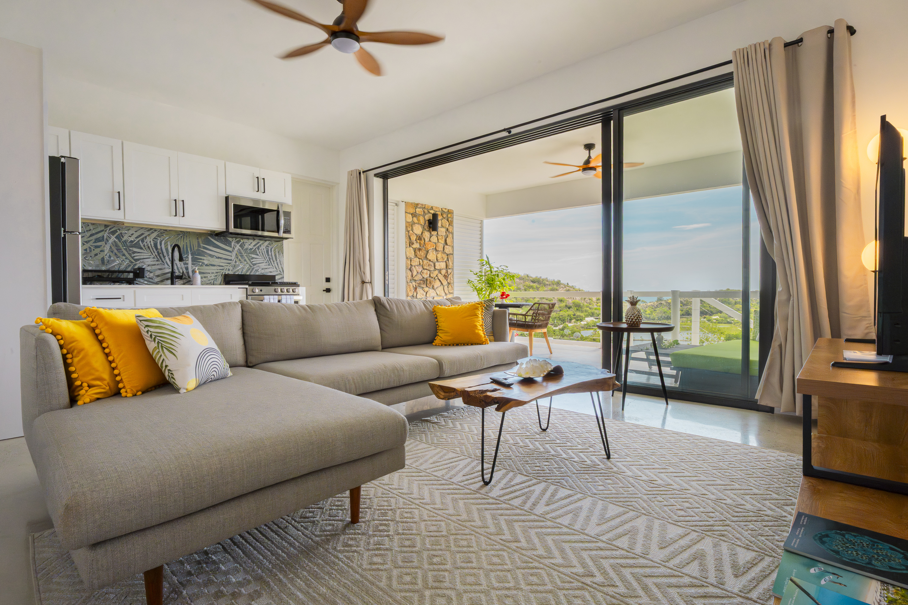 Galley Bay Apartment Egret - studio interior with open terrace and Caribbean views